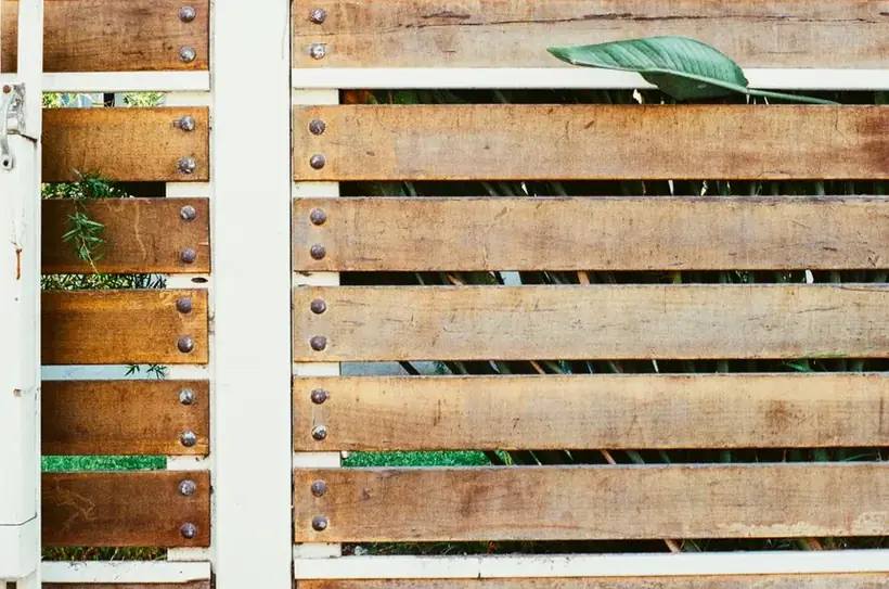 Wooden garden fence panel marking a property boundary