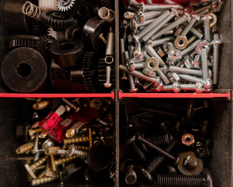 Close-up of stainless steel screws and fixings used to fit roof deterrent hardware