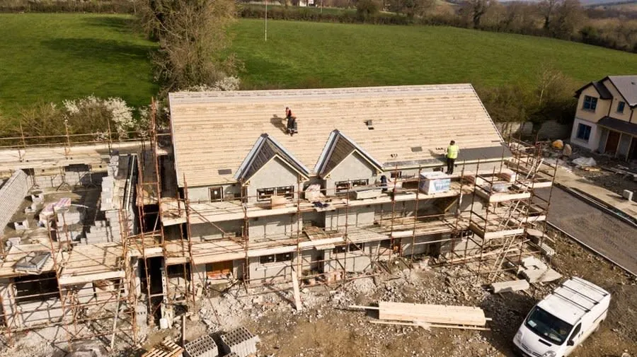 New build house with roof underlay and battens in place before tiling
