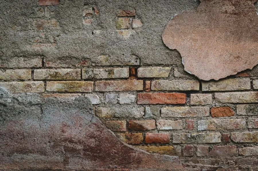 Cracked and crumbling mortar along an old roof ridge