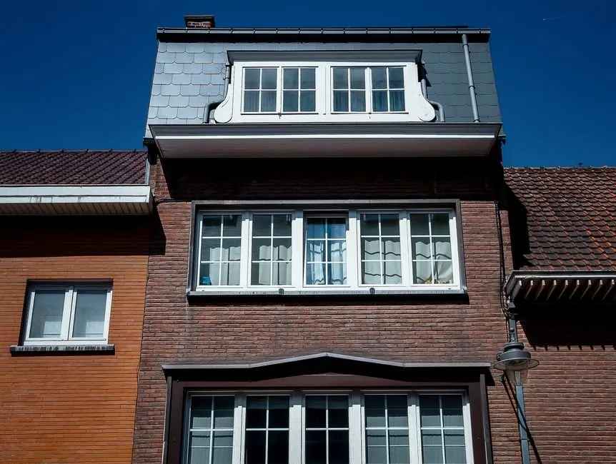 A flat-roofed dormer and rear extension on a British house