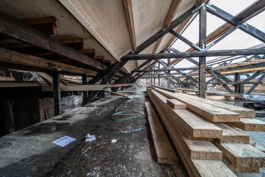 Wooden beams and rafters viewed inside a loft under construction