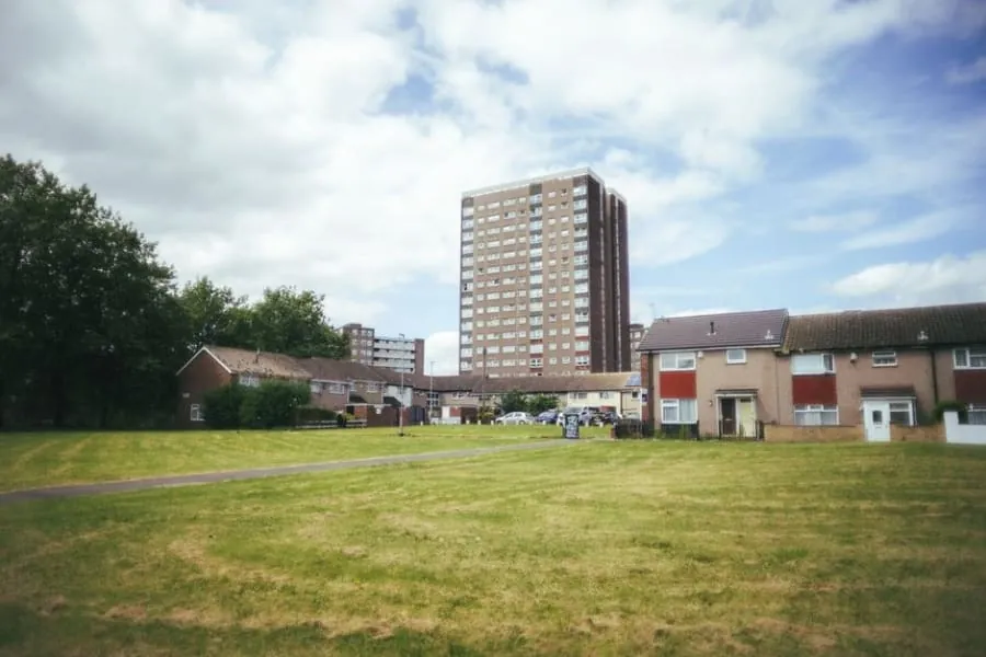 Purpose-built residential tower block and low-rise flats in a Yorkshire town