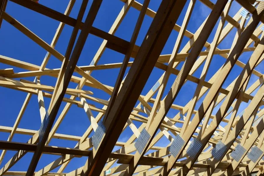 Timber roof framing and rafters on a house under construction