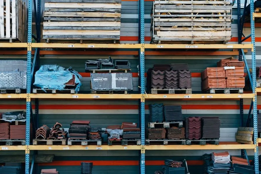 Racks of roof tiles, ridge tiles and roofing components at a builders merchant