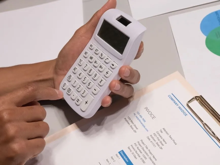 Calculator and paperwork used for working out building costs