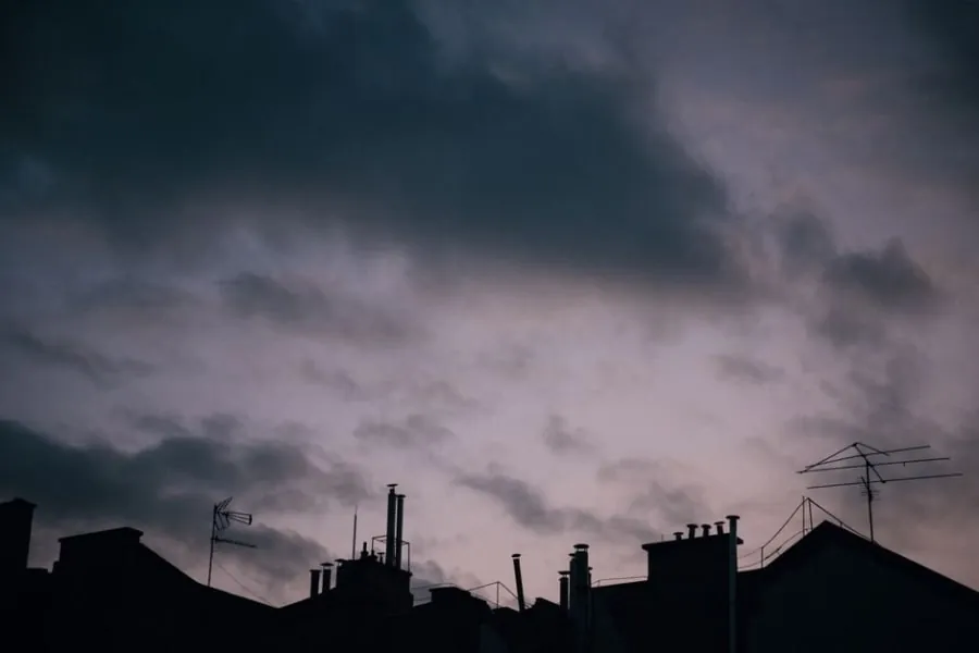 Dark rain clouds gathering over rooftops in North Yorkshire