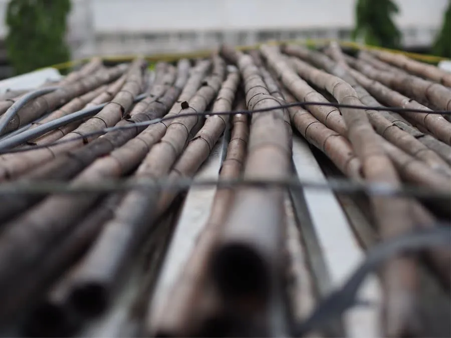 Stacked scaffolding poles and fittings ready for erection