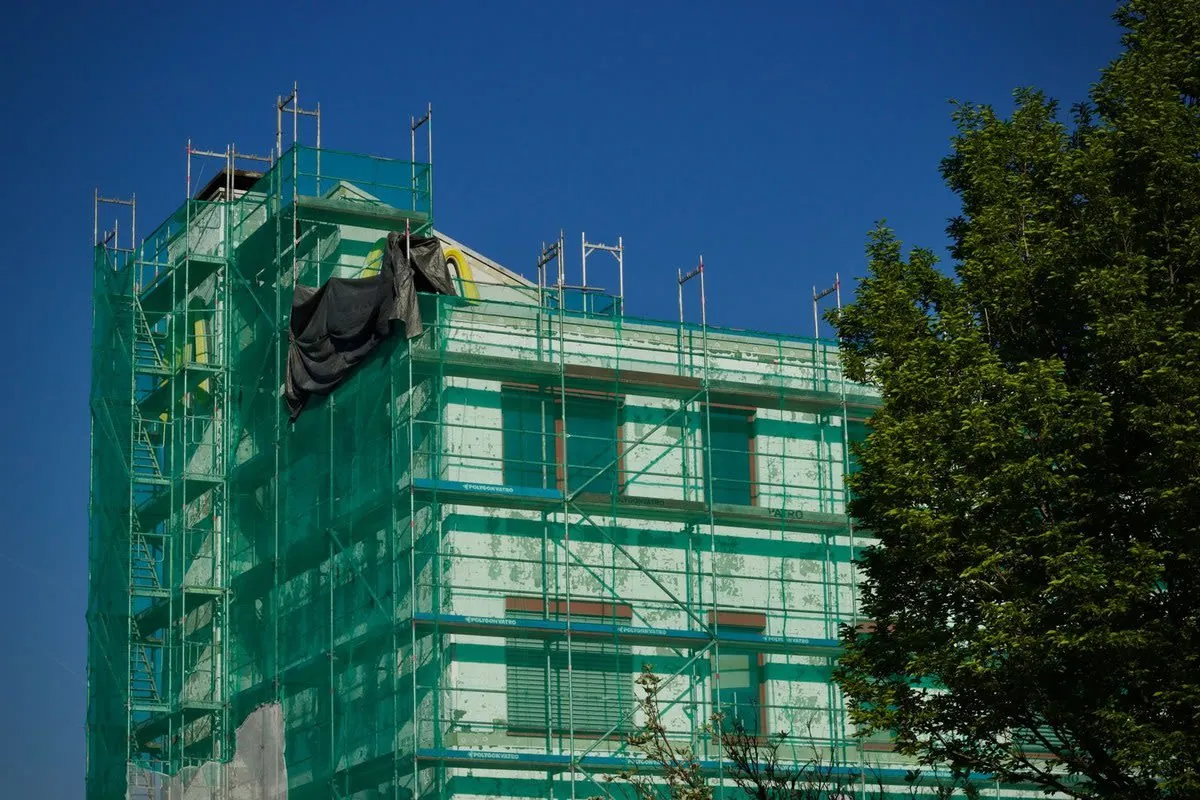 Scaffolding erected around a house for roof work